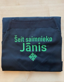 Apron "Hosted here Jānis" black